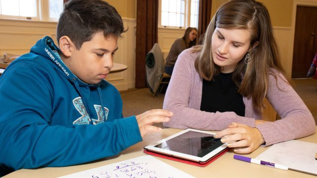 Two students working on an iPad