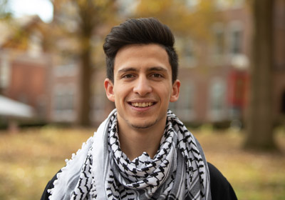 Man in black and white scarf smiles at the camera|||Photo of Haitham Alatawneh|Photo of Haitham Alatawneh||Photo of Haitham Alatawneh|
