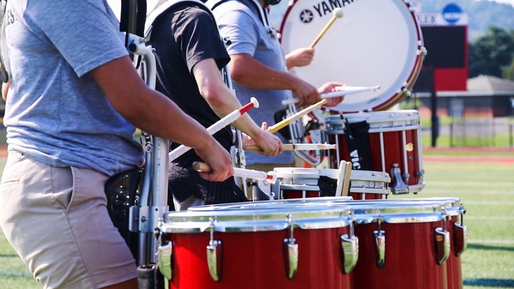 Members of a drumline play