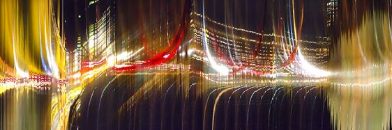 Red, gold and white streaks of light from the Hampton Roads Bridge