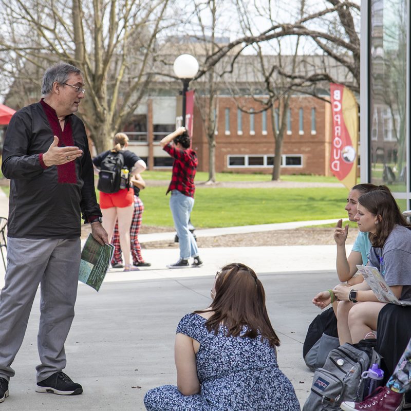 Professor teaching a class outside the F-L-C