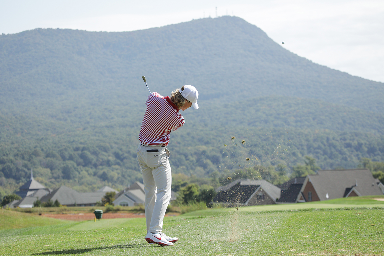 Golfer hitting the ball