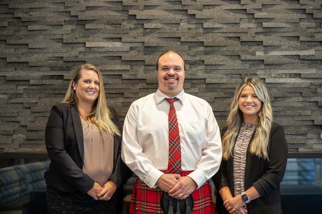 Three certified staff members from Bridgewater College’s Financial Aid Department, from left, Associate Director of Financial Aid Betsy Henderson, Director of Financial Aid Joshua North and Financial Aid Counselor Tori Pullin.