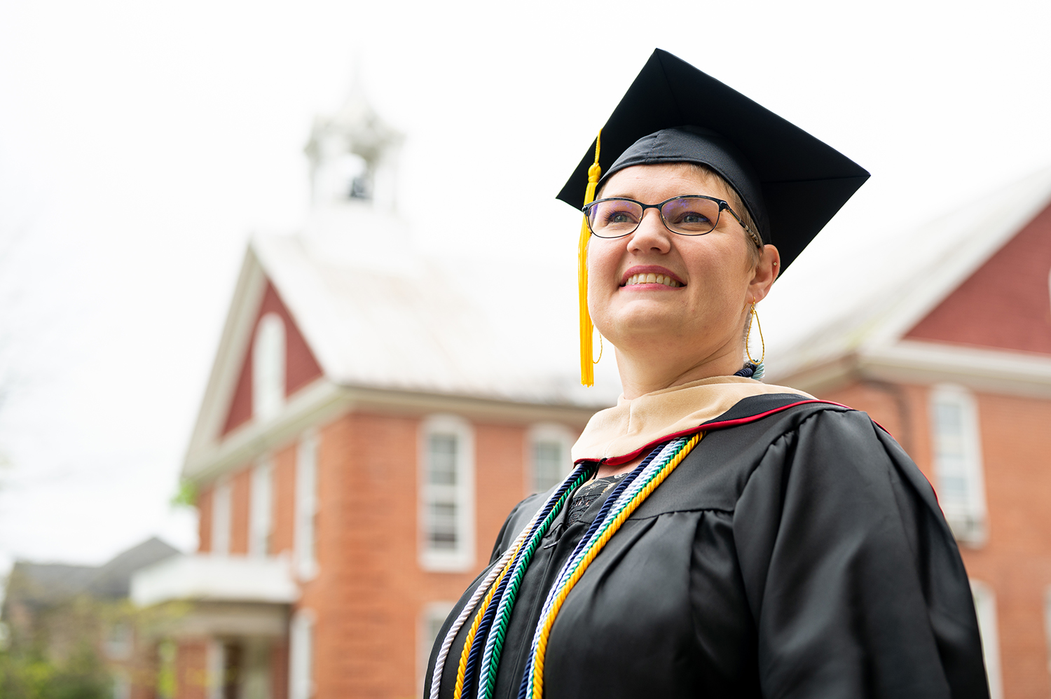 Bridgewater College graduate standing proudly