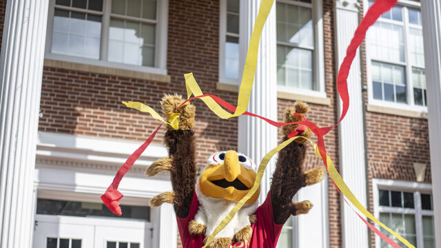 Ernie the Eagle mascot throwing streamers