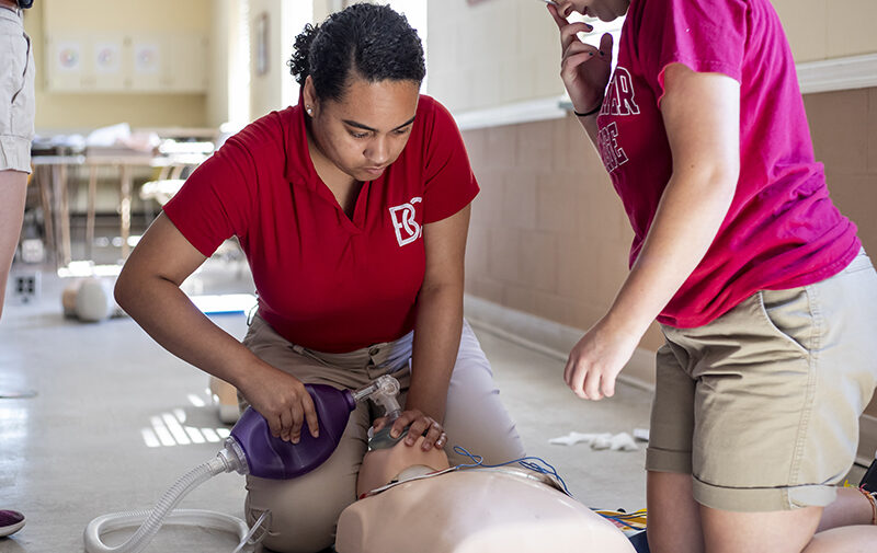 Students learning C-P-R on a dummy