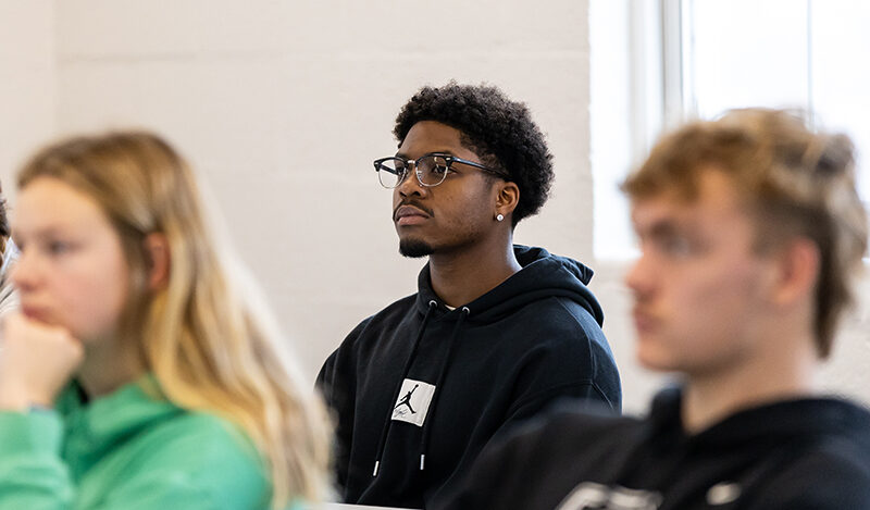 Student sitting looking attentive in class