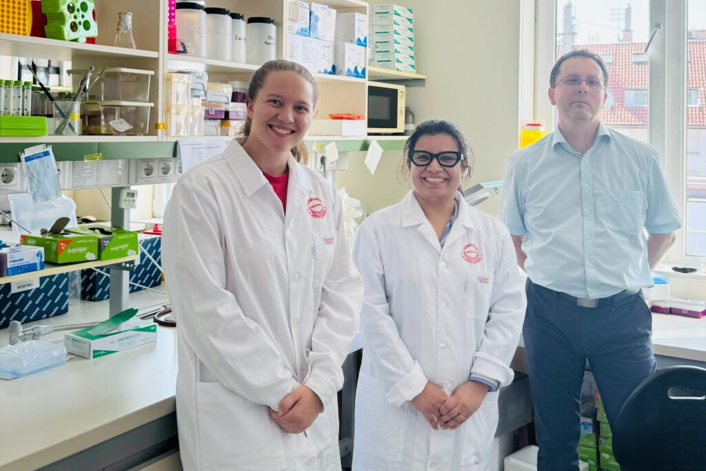 Student and faculty in lab.