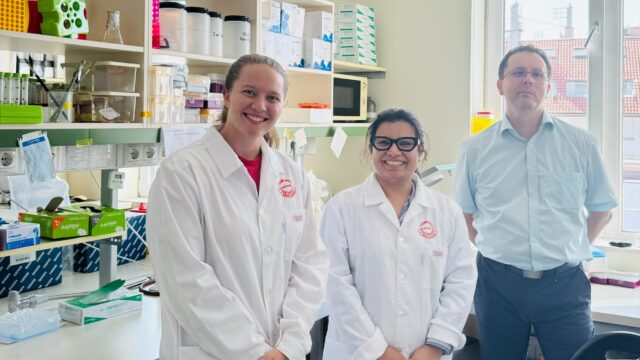 Student and faculty in lab.