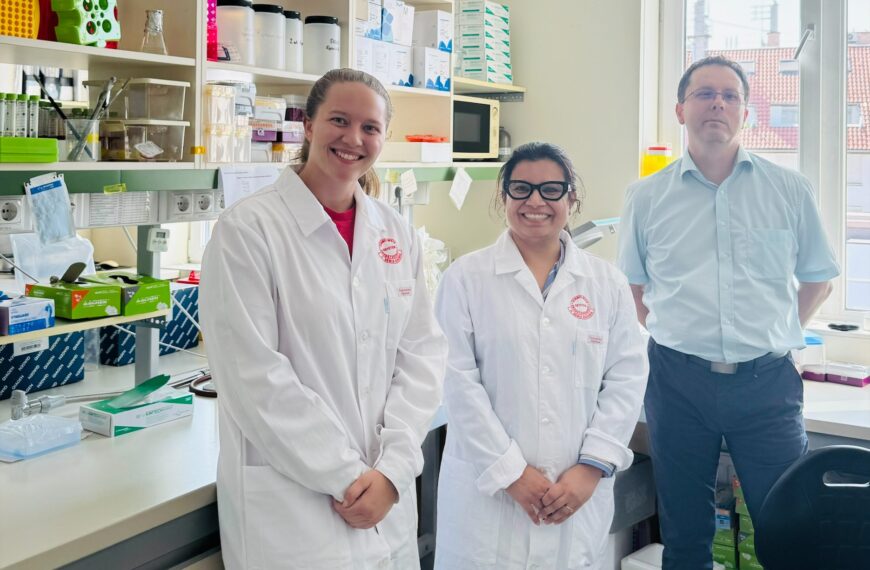 Student and faculty in lab.