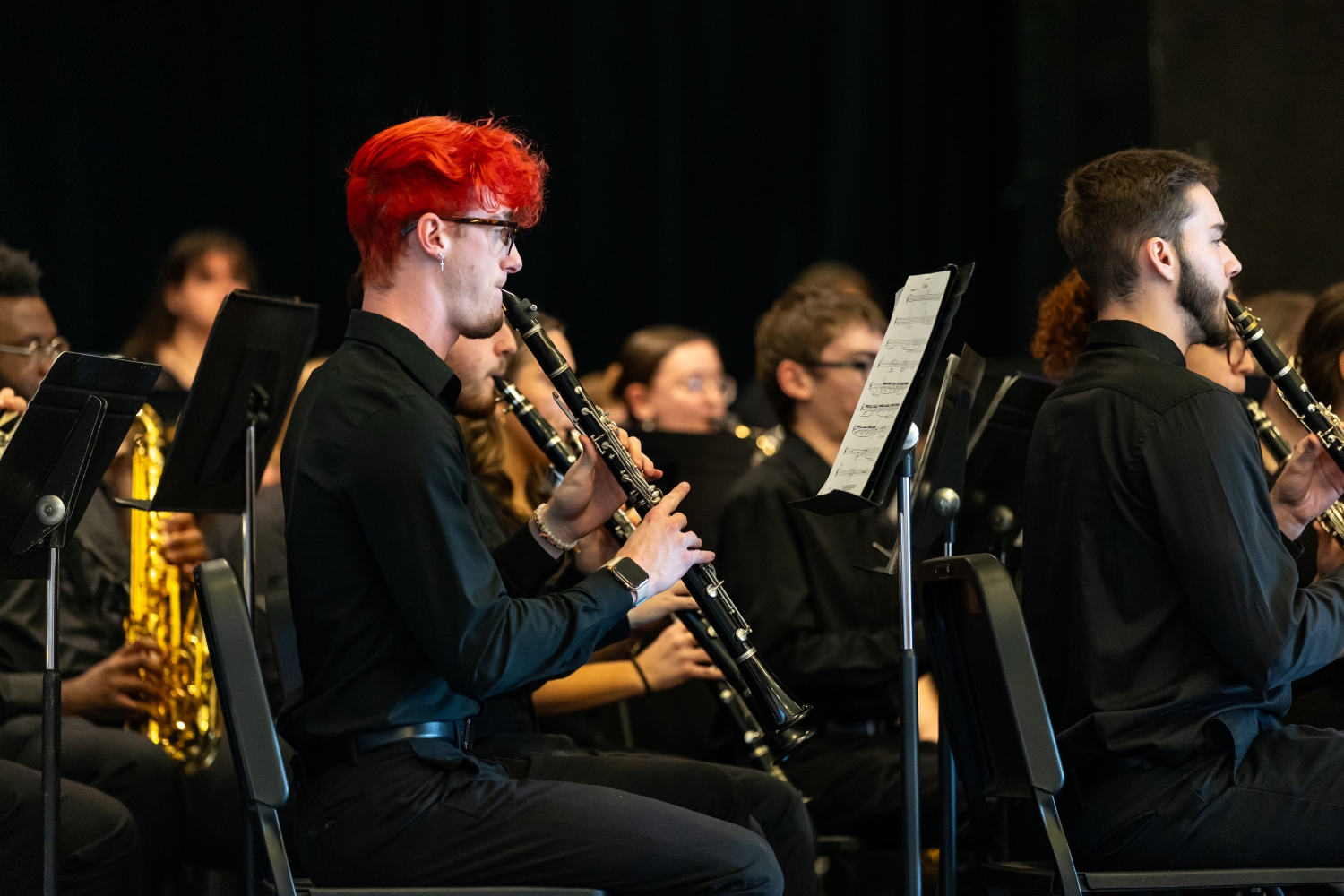 symphonic_band_concert_0031 Clarinet player with red hair plays intently