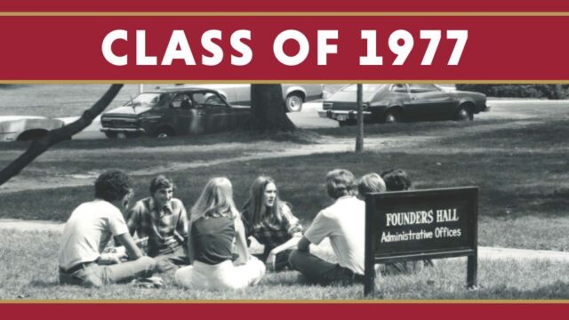 Students sitting in a circle in the grass in 1977