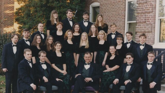 Jesse Hopkins surrounded by students